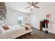 Stylish bedroom with hardwood floors, closet and serene water view at 7115 Bay St, St Pete Beach, FL 33706