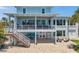 Spacious home with a large balcony and outdoor patio perfect for entertaining at 7115 Bay St, St Pete Beach, FL 33706