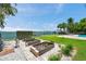 Lovely backyard garden area with raised planting beds overlooking the canal and private dock at 7115 Bay St, St Pete Beach, FL 33706