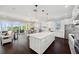 Bright white kitchen with marble countertops, stainless steel appliances, and an island perfect for entertaining at 7115 Bay St, St Pete Beach, FL 33706