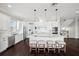 Open kitchen with a marble island, stainless steel appliances, and stylish seating perfect for Gathering gatherings at 7115 Bay St, St Pete Beach, FL 33706