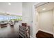 Open-concept living area featuring an elevator, hardwood floors, and water views at 7115 Bay St, St Pete Beach, FL 33706