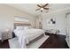 Bright main bedroom showcasing wood floors, neutral decor, and a tranquil retreat at 7115 Bay St, St Pete Beach, FL 33706