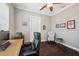 Comfortable home office with dark wood floors, neutral paint, and a modern desk at 7115 Bay St, St Pete Beach, FL 33706