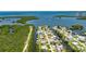 Stunning aerial view showcases the coastal community, picturesque waterways, and lush green surroundings at 825 Seabreeze Dr, Ruskin, FL 33570