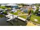 Stunning waterfront home featuring a private boat dock, fire pit, and charming storage shed at 825 Seabreeze Dr, Ruskin, FL 33570