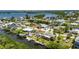 Desirable waterfront property featuring a private dock, scenic canal views, and lush landscaping at 825 Seabreeze Dr, Ruskin, FL 33570