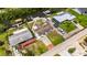 This aerial view displays the property's backyard, boat lift, and neighborhood at 825 Seabreeze Dr, Ruskin, FL 33570