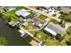 Waterfront property featuring a private dock, inviting backyard firepit, and charming shed at 825 Seabreeze Dr, Ruskin, FL 33570