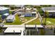 Inviting waterfront property features a private dock, firepit, storage shed, and well-kept backyard at 825 Seabreeze Dr, Ruskin, FL 33570