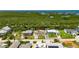 This home has a lovely waterfront location with a dock, firepit, and lush greenery at 825 Seabreeze Dr, Ruskin, FL 33570