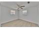 An airy bedroom with light wood-look flooring and a ceiling fan for added comfort at 825 Seabreeze Dr, Ruskin, FL 33570