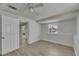 Bedroom with wood-look flooring, window, and closet at 825 Seabreeze Dr, Ruskin, FL 33570