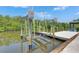 Modern boat lift providing convenient access to the scenic waterway at 825 Seabreeze Dr, Ruskin, FL 33570