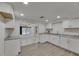 Well-lit kitchen with white cabinets and granite countertops at 825 Seabreeze Dr, Ruskin, FL 33570
