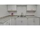 Kitchen with stainless steel double sink and ample counter space at 825 Seabreeze Dr, Ruskin, FL 33570