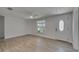 Bright living room with modern flooring, window, and white front door at 825 Seabreeze Dr, Ruskin, FL 33570