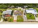 Aerial shot displaying the property lines, boat lift, backyard, and neighborhood at 825 Seabreeze Dr, Ruskin, FL 33570