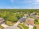 Aerial perspective of home showing landscape and neighborhood in a suburban setting at 8504 Tidal Bay Ln, Tampa, FL 33635