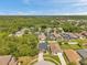 An aerial view of a residential neighborhood shows lush landscaping and well-maintained single Gathering homes at 8504 Tidal Bay Ln, Tampa, FL 33635