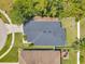 Aerial view of the property showcasing the roof, backyard, and surrounding landscape at 8504 Tidal Bay Ln, Tampa, FL 33635