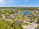 This is a high angle, aerial view of a neighborhood with a lake nearby at 8504 Tidal Bay Ln, Tampa, FL 33635