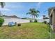Spacious, fenced-in backyard features a seating area and well-maintained lawn at 8504 Tidal Bay Ln, Tampa, FL 33635