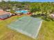 The aerial view of the basketball court, next to the pool, showcases a great recreational amenity for the community at 8504 Tidal Bay Ln, Tampa, FL 33635