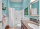 Bright bathroom features granite counters, bathtub with shower, and neutral wall colors at 8504 Tidal Bay Ln, Tampa, FL 33635