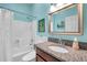 Bright bathroom features granite counters, bathtub with shower, and neutral wall colors at 8504 Tidal Bay Ln, Tampa, FL 33635