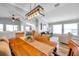 Dining room open to the living room, with a wooden table and hardwood floors at 8504 Tidal Bay Ln, Tampa, FL 33635