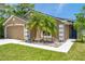 Charming single-story home with a well-maintained lawn, decorative rock garden, and welcoming curb appeal at 8504 Tidal Bay Ln, Tampa, FL 33635