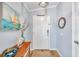 Inviting foyer with light wood floors, a stylish mirror, and coastal-inspired decor at 8504 Tidal Bay Ln, Tampa, FL 33635