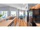 Bright kitchen area with stainless steel sink, wood cabinets, and black refrigerator at 8504 Tidal Bay Ln, Tampa, FL 33635