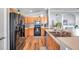 Kitchen area featuring wood cabinets, black appliances, and plenty of counter space at 8504 Tidal Bay Ln, Tampa, FL 33635