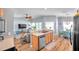 Open-concept living area with kitchen, dining, and living room creating a welcoming space at 8504 Tidal Bay Ln, Tampa, FL 33635