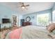 Inviting main bedroom features wood-look floors, an ensuite bathroom, and a walk-in shower at 8504 Tidal Bay Ln, Tampa, FL 33635