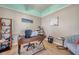Well-lit office with wood floors, decorative shelves, and a comfortable desk setup at 8504 Tidal Bay Ln, Tampa, FL 33635