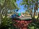 The community playground is nestled among mature trees, offering a fun and safe space for children to play at 8504 Tidal Bay Ln, Tampa, FL 33635