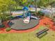 Community playground featuring slides, climbing structures, and seating areas for families to enjoy at 8504 Tidal Bay Ln, Tampa, FL 33635