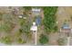 Overhead view of the home with an adjacent pool and surrounding foliage at 9615 Jasmine Blvd, New Port Richey, FL 34654
