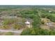 Expansive aerial view showcasing the home's large lot surrounded by lush greenery and mature trees at 9615 Jasmine Blvd, New Port Richey, FL 34654