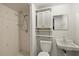 Cozy bathroom featuring a walk-in shower, vanity, and toilet, blending functionality with charm at 9615 Jasmine Blvd, New Port Richey, FL 34654