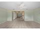 Open-concept living room featuring neutral walls and tiled floor, ready for your personal touch at 9615 Jasmine Blvd, New Port Richey, FL 34654