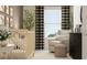 Inviting Bedroom featuring a crib, upholstered glider, and patterned black-out curtains at 10229 Trumpet Honeysuckle Way, San Antonio, FL 33576