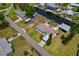 A waterfront home with RV parking, a boat lift, and additional storage building at 103 W North Branch Rd, Ruskin, FL 33570