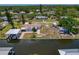 Aerial view featuring a waterfront property, boat dock, and a spacious backyard at 103 W North Branch Rd, Ruskin, FL 33570
