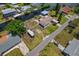 A waterfront home featuring a boat lift, RV parking, and additional storage building at 103 W North Branch Rd, Ruskin, FL 33570