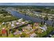 Aerial view of the waterfront home with access to the water and surrounding canal community at 103 W North Branch Rd, Ruskin, FL 33570