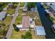 A waterfront home featuring RV parking, a boat lift, and low maintenance landscaping at 103 W North Branch Rd, Ruskin, FL 33570
